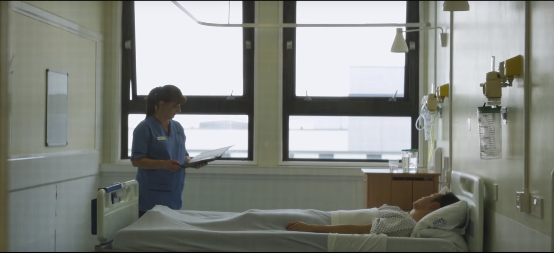 Background image showing nurse by the bedside